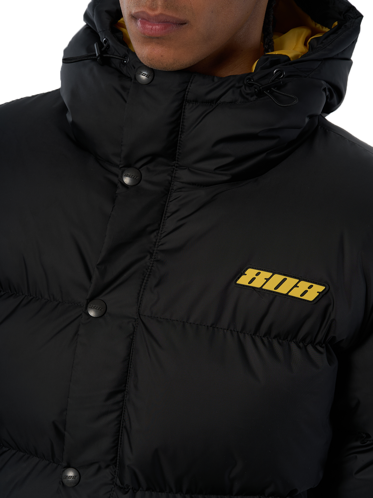Schwarze Winterjacke Puffer Jacket Gelbes Logo