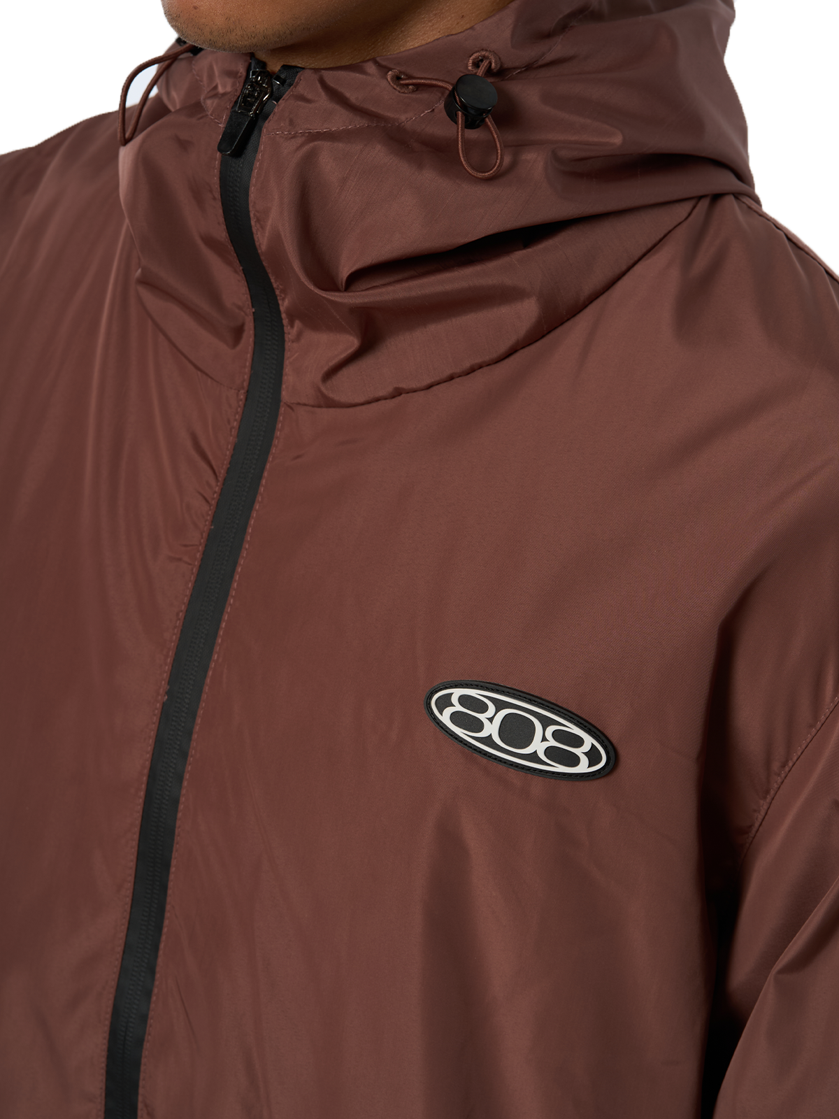 Brauner Windbreaker Regenjacke Wasserfest Weißes Logo